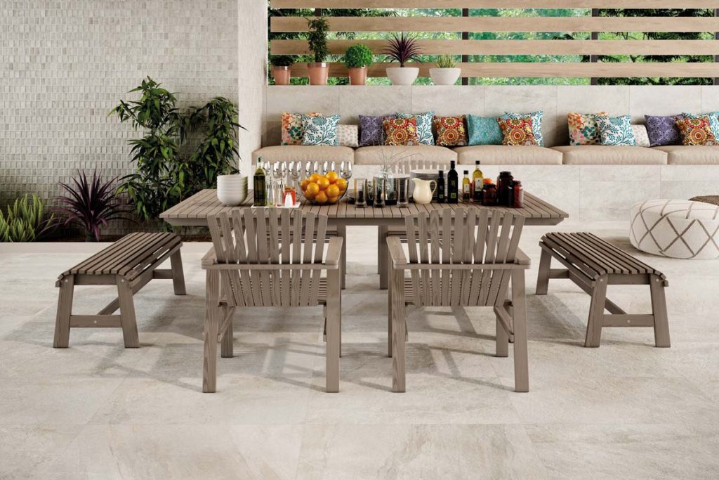 Outdoor stone effect tiles with outdoor table.