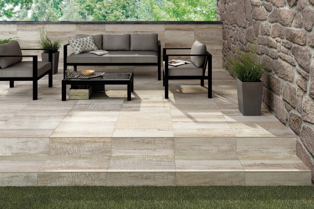 Outdoor wood effect tiles with outdoor seating.